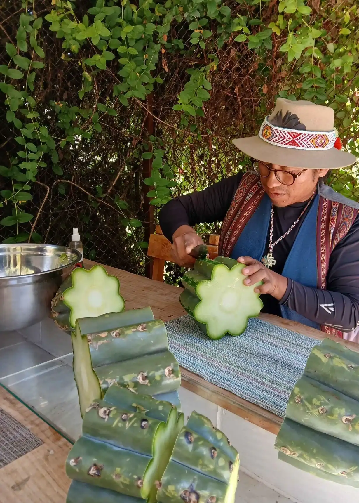 Andean facilitator preparing San Pedro cactus for ceremony, Cusco