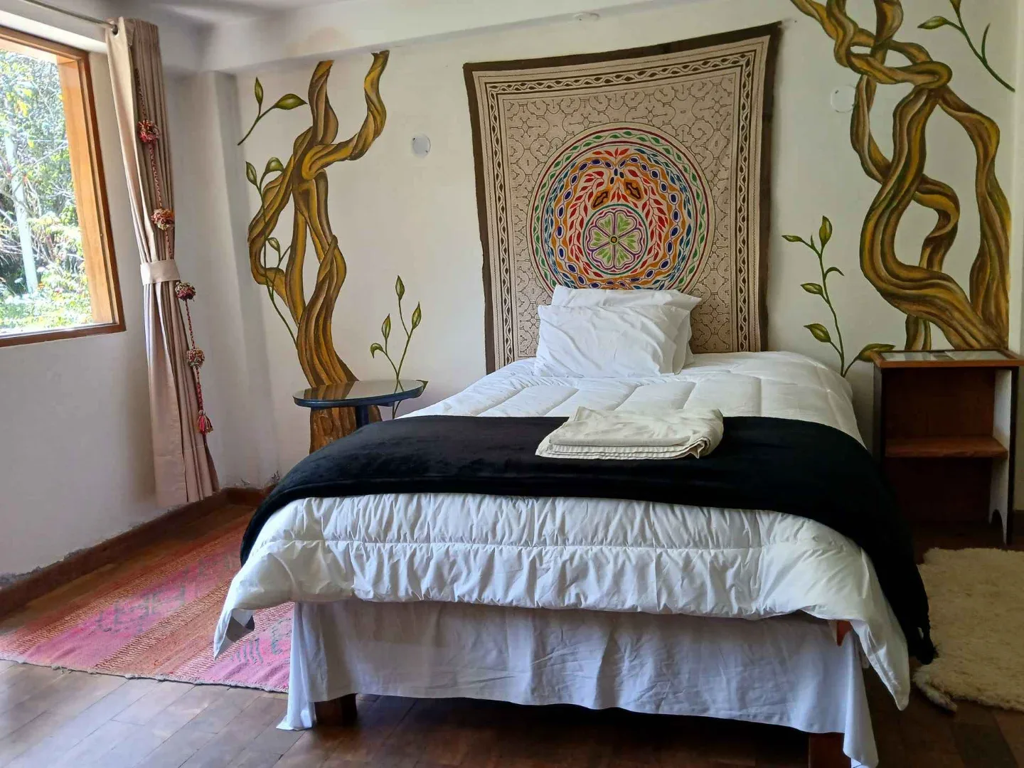Private retreat bedroom with Shipibo tapestry, Willka Pacha